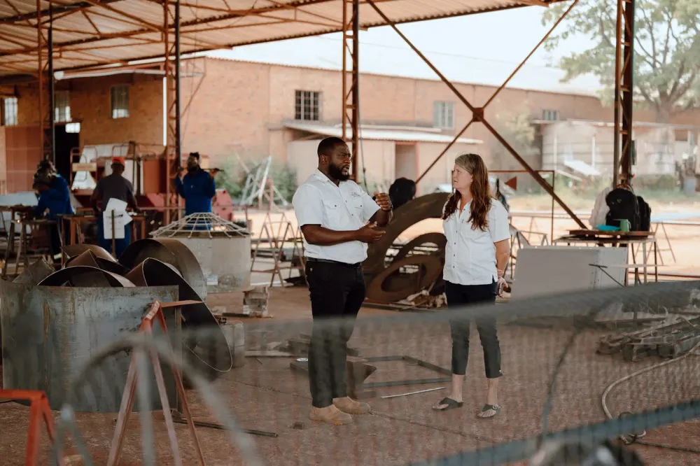 ROC Systems team discussing equipment and farm planning in the Chinhoyi workshop